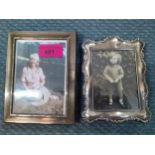 A silver photo frame 6" high and a white metal photo frame, 5 1/2" high Location: