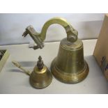A 20th century ship's bell on a bracket, and another similar Location: