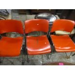 A group of three Seid International office stackable metal chairs designed by David Rowland circa