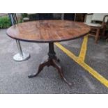 A George III mahogany pedestal tip top table over a writhen carved column, on a tripod base 71cm h x