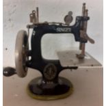 A 1920's American Singer Manufacturing Company miniature sewing machine Model No:20. Location:R1:2