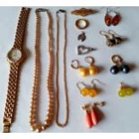 A small quantity of costume jewellery to include silver items, faux vintage pearls and a Timex