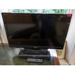 A Panasonic 32" TV with remote control and DVD recorder Location: