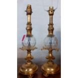 A pair of reproduction glass and gold painted table lamps Location: BWR