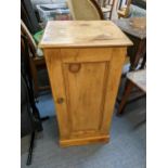 A Victorian pine cupboard having a single panelled door and on a plinth base, 75cm h x 36.5cm w