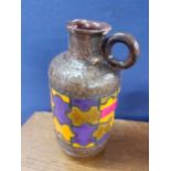 A mid 20th century Bitossi pottery jug designed by Aldo Londi in the puzzle design, in orange, brown