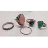 Five fashion rings to include a 9ct gold and silver flower ring having a central green paste