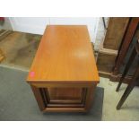 A 1970s McIntosh teak foldover table with nest of two inset tables Location: