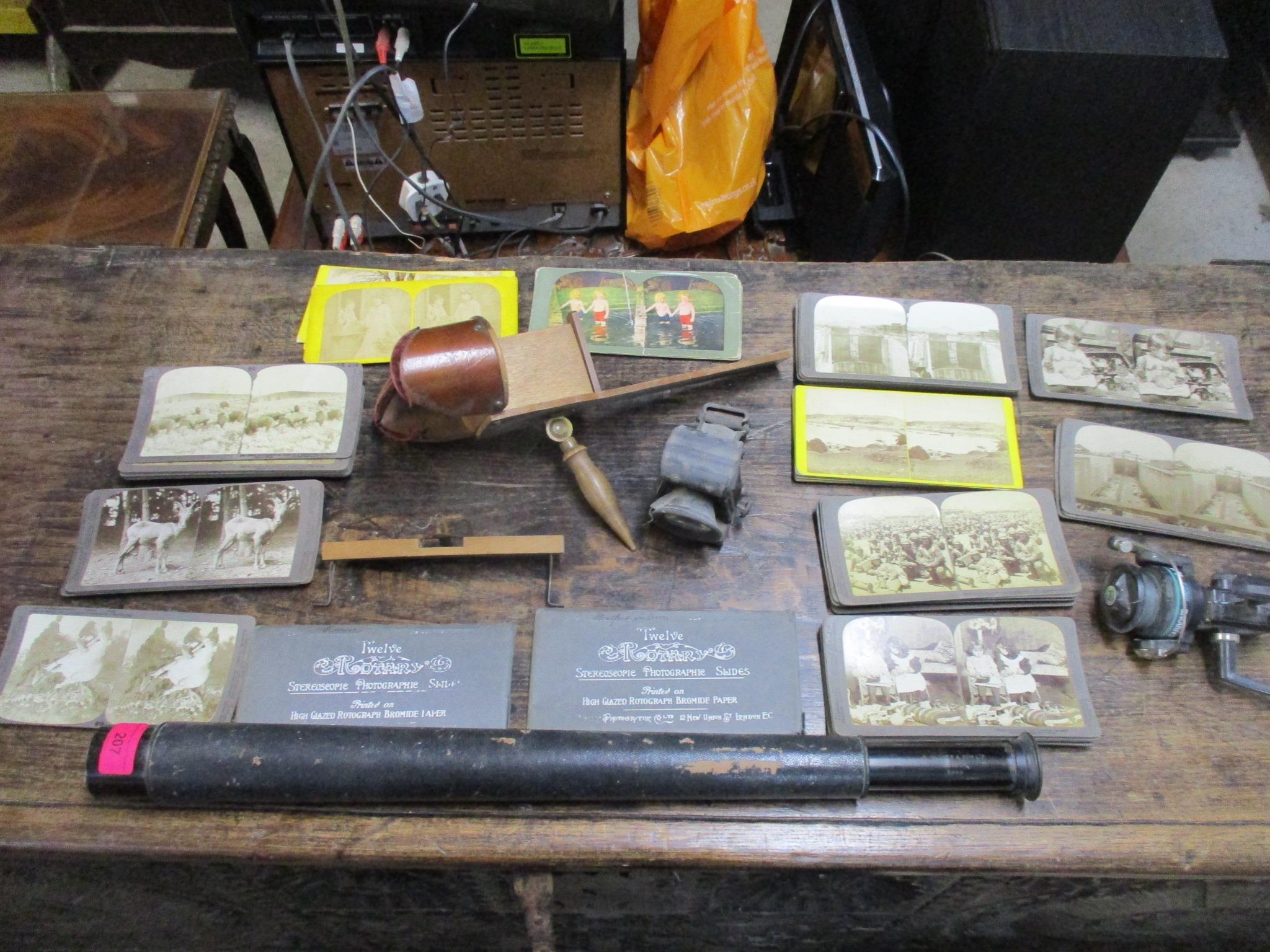 A Victorian Stereoscope with various slides, a vintage Combes Bros bicycle lamp, a Hughes & Son