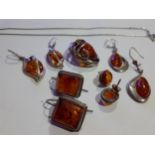 A selection of modern silver and amber costume jewellery.