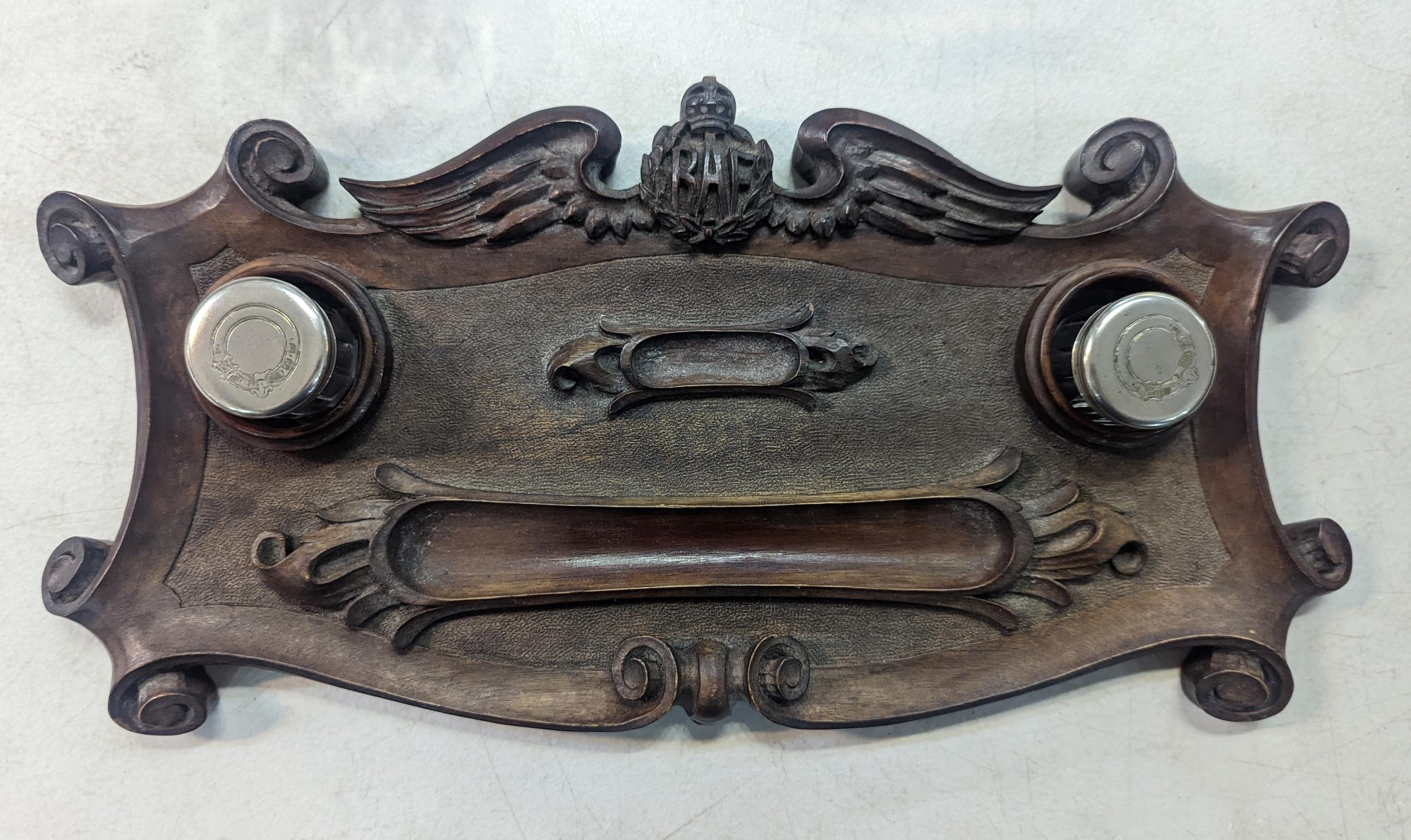 A carved mahogany desk tidy, carved with RAF insignia, reputedly from Commanding Officers desk at