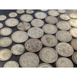 A group of British coinage to include George V and VI half crowns, florins, shillings an six