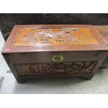 A vintage Chinese camphor wood carved blanket chest Location: