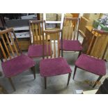 A set of mid century G-plan dining chairs with padded seats, comprising four standards and one