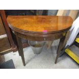 A Waring & Gillows mahogany demi-lune foldover games table with inset drawer Location: