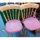 A pair of beech kitchen chairs together with a folding card table having a green felt top