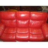 A contemporary red leather three seater sofa Location: