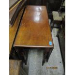 An early Victorian mahogany gate-leg table on ring turned legs 75cm x 92cm x 38cm (when unextended),