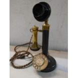 A black painted and brass candlestick telephone Location: 11.2