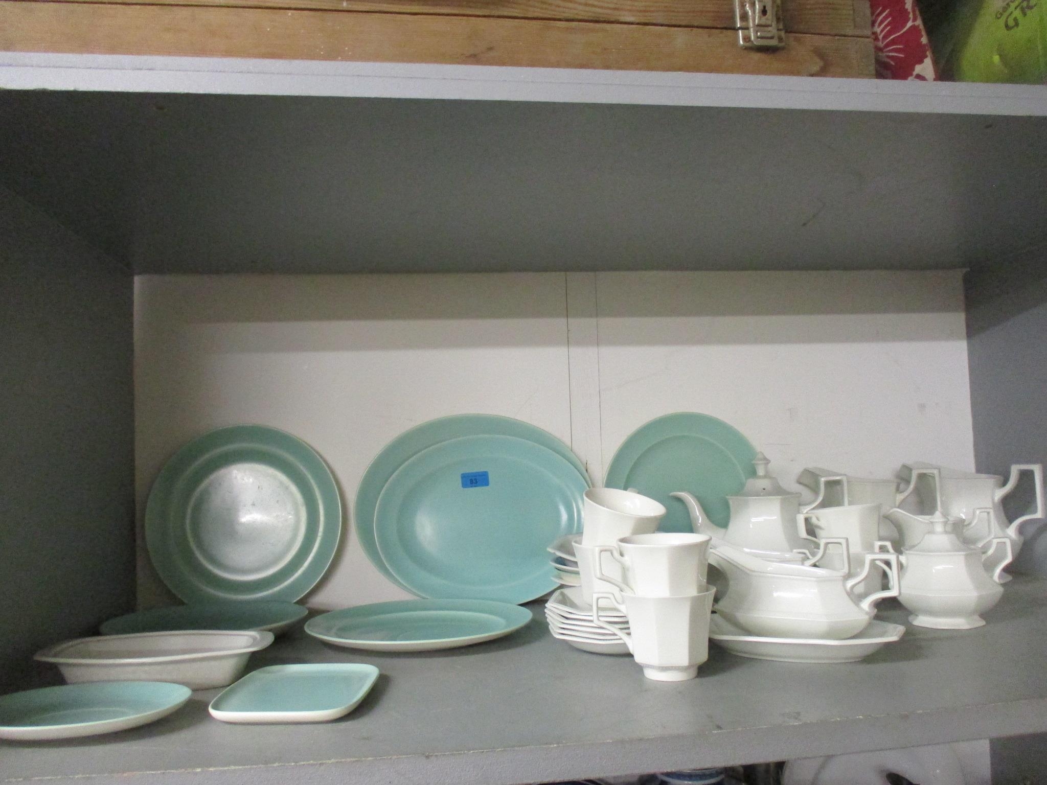 A group of Poole pottery two-tone plates and meat platters, and a Johnson Bros part dinner service