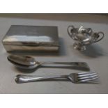 Silver to include a tablespoon and fork, and a sugar bowl 217g, and a cigarette box Location: