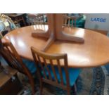 A G-plan teak extendable table and four G-plan slat back Fresco dining chairs Location: A3M
