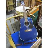 A Frishman FA 100 acoustic guitar in blue colourway, along with a wooden recorder Location: