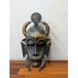 A Senufo painted metal mask Location: A4F