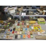 A mixed lot to include playing cards, bone dominoes, toy figures such as cowboys, soldiers,