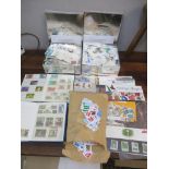 A quantity of stamps to include two tins of mainly Belgium loose stamps, two albums of Magyar and