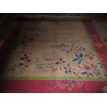 A large hand woven Chinese carpet, floral pattern on a grey ground, probably 1950s, approximately