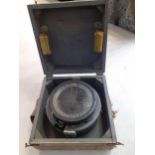 A naval compass in wooden case Location: RAF