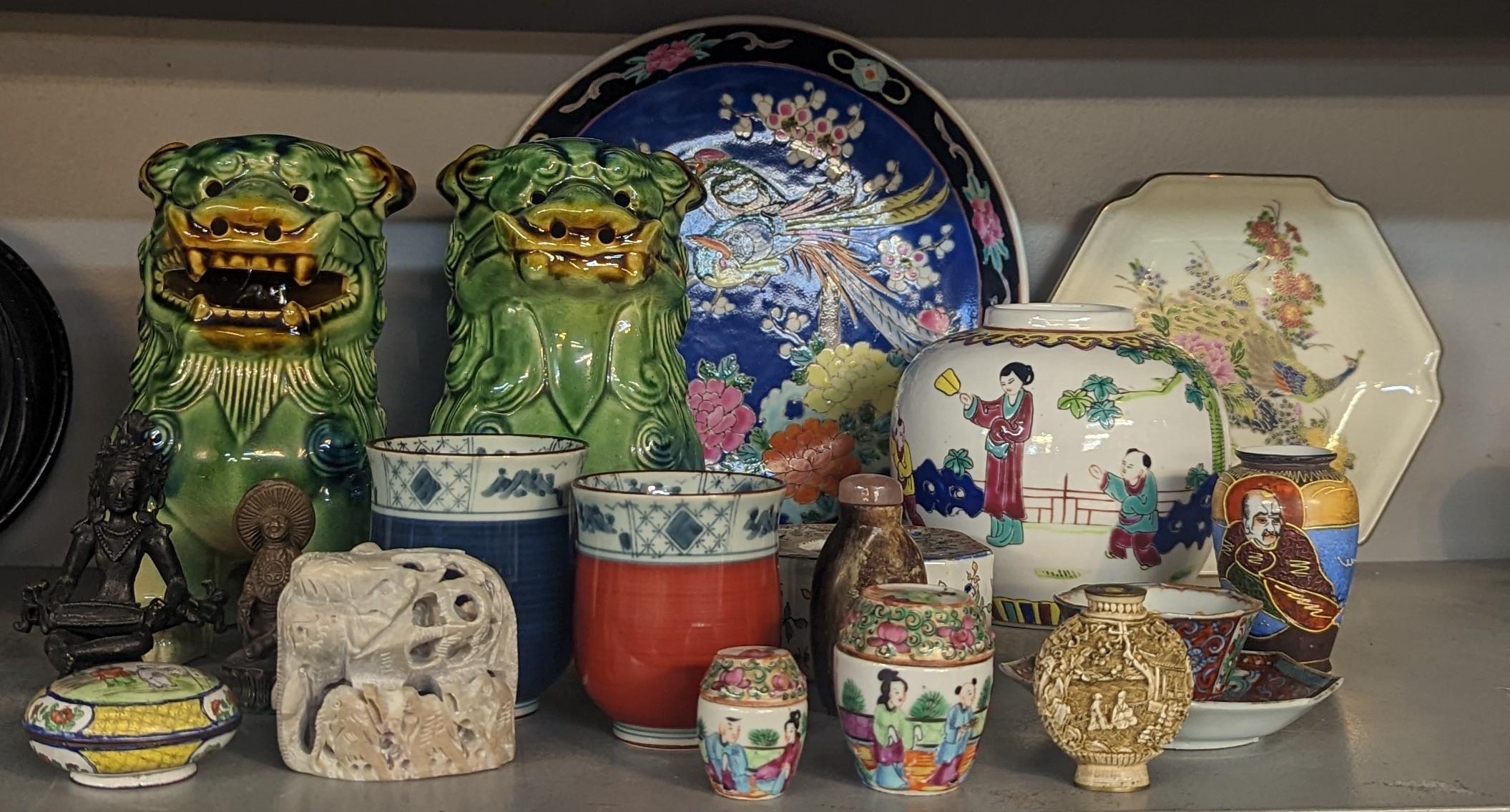 A mixed lot of Oriental ceramics and figures to include tea bowl and saucer, ginger jar, model