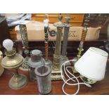 A group of table lamps to include a Wade pottery lamp, and a brass lamp, along with a copper oil