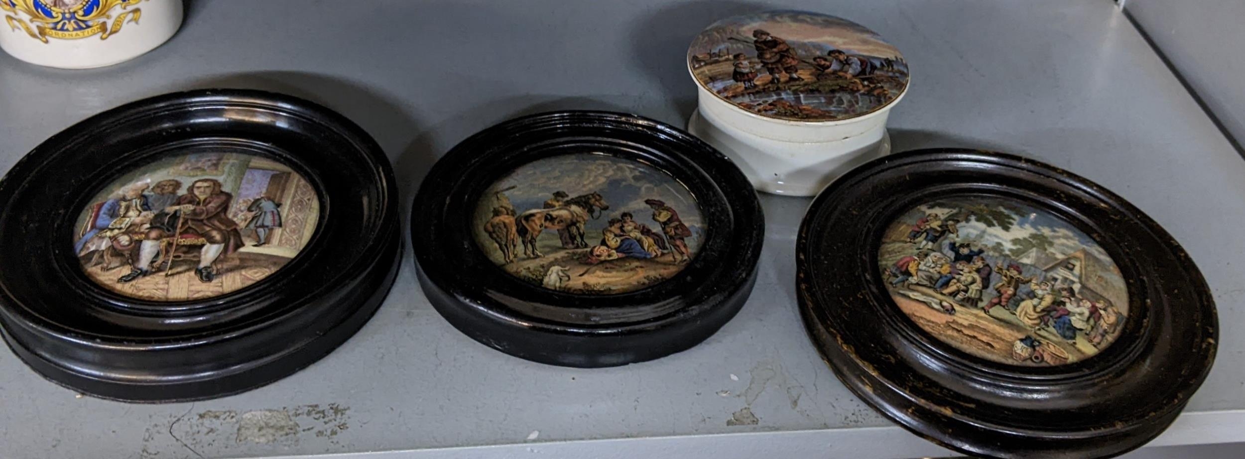 Four Prattware pot lids to include the Village Wedding, three framed, one on a pot Location: 8.2