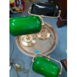 A low brass Eastern table together with three brass reading lights with green glass shades Location: