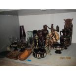 A mixed lot to include a pair of brass snake candlesticks, Greek pottery, wooden elephants, and