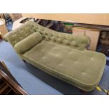A Victorian green button back upholstered chaise longue and on turned legs, 76cm x 188cm Location: