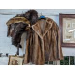 A vintage brown musquash jacket, together with a wolf stole, a mink stole, and a wolf fur hat