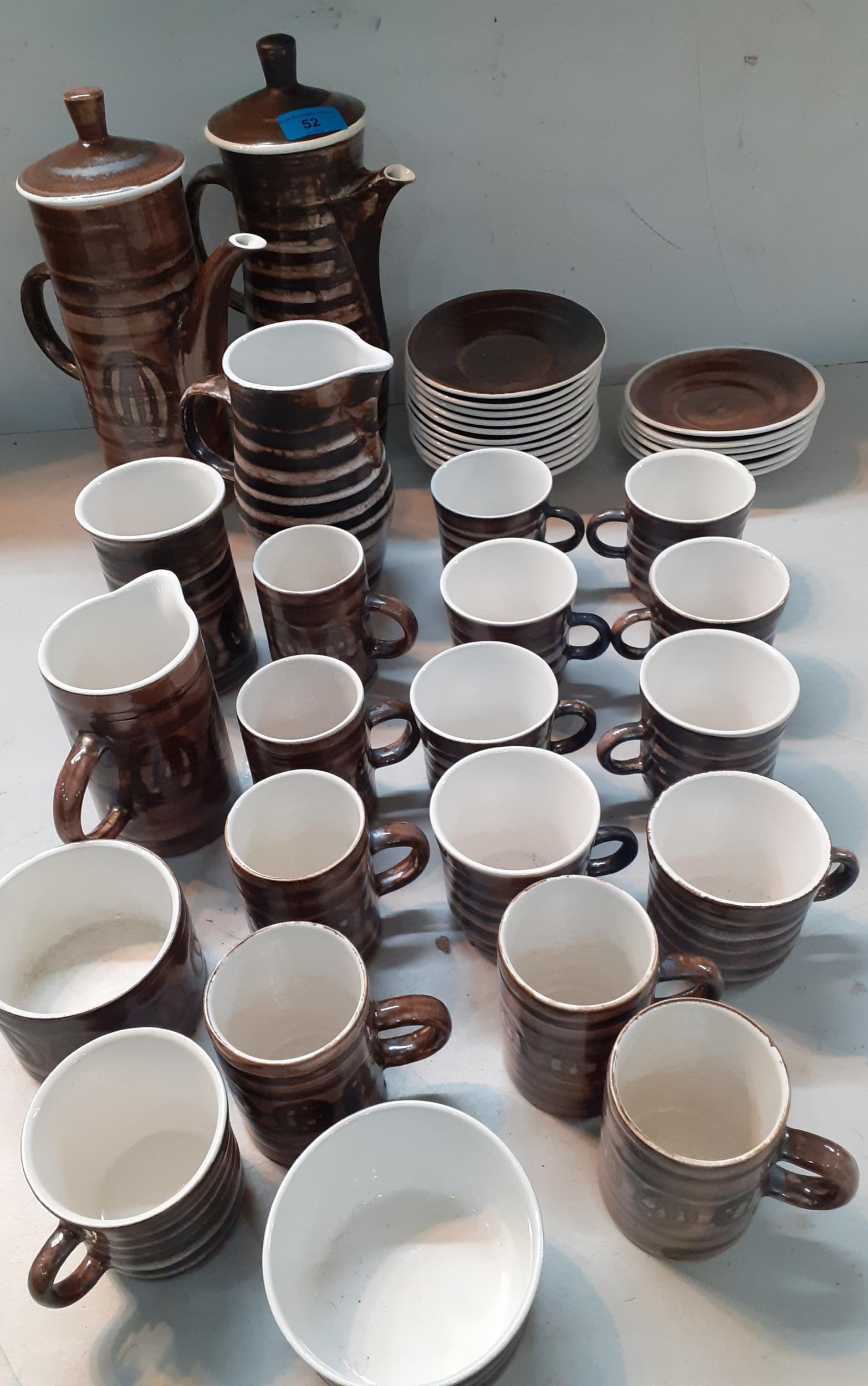 A Rye pottery coffee and tea set comprising two pots, two jugs, nine tea cups, six coffee cups,