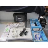 A Nintendo Wii, together with a balance board, games and accessories Location: