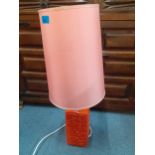 A retro orange pottery lamp with pink shade and a pair of vintage Tango spatter glass vases