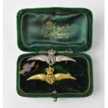 Two enamelled RAF brooches, one silver and one 9ct yellow gold, with green enamelled wreath,