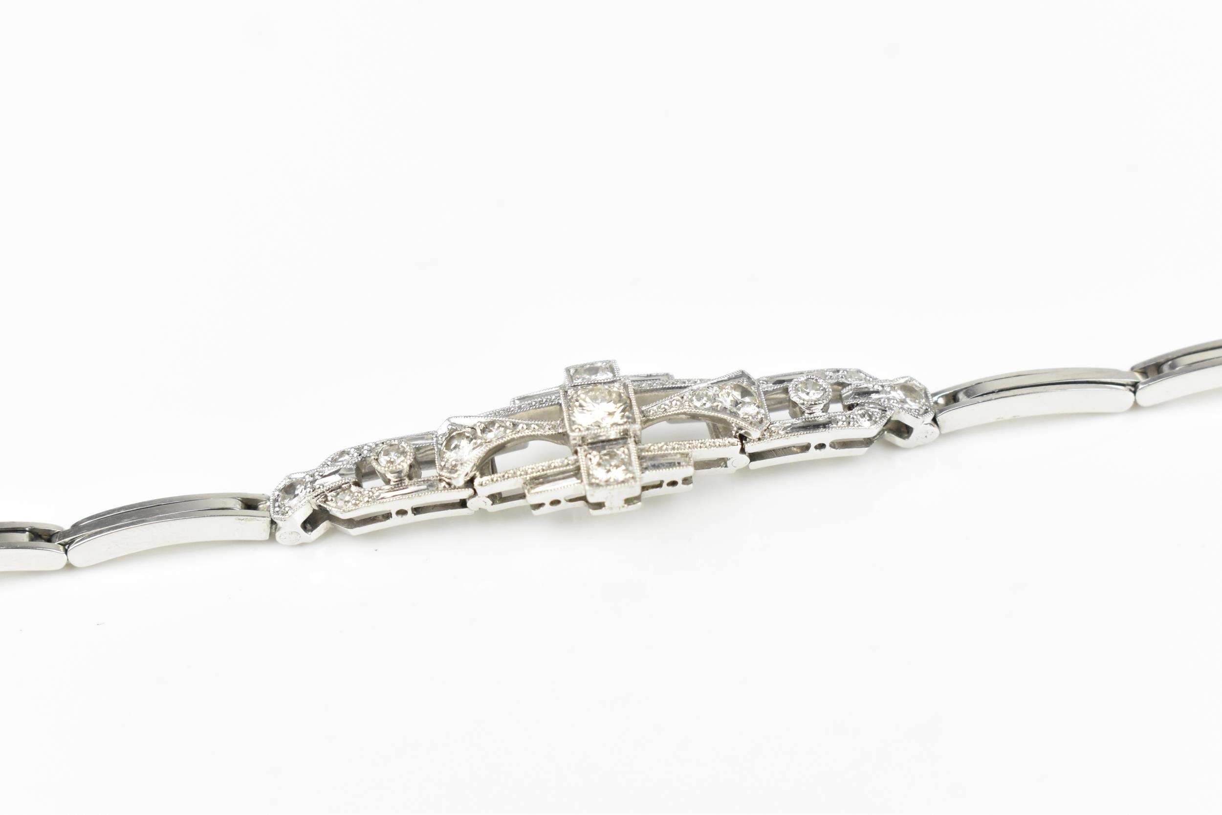 An Art Deco 18ct white gold and diamond bracelet, with stretch bracelet, inset with thirteen central - Image 6 of 11