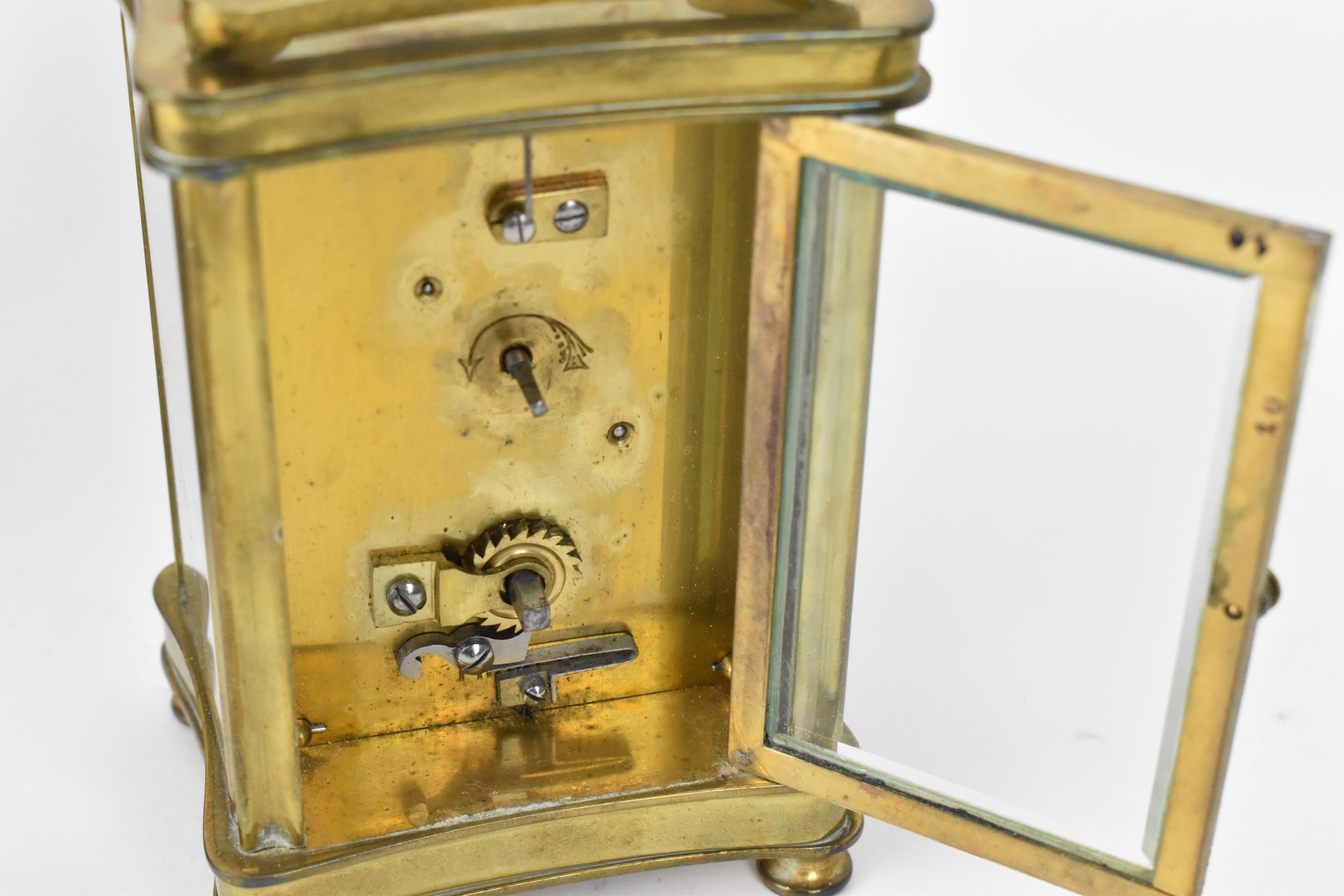 An early 20th century brass cased carriage clock in a fitted travel case having a white enamel - Image 8 of 10