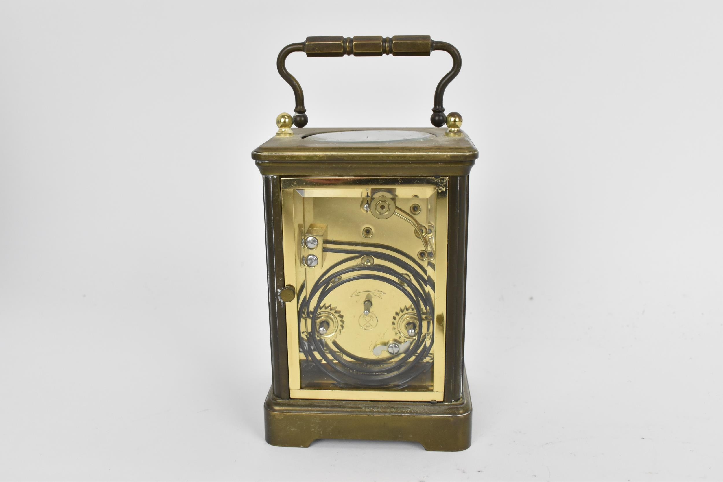 An early/mid 20th century brass cased carriage clock, white enamel dial signed 'Rapport Fondee en - Image 5 of 7