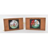 Two Victorian mahogany-mounted hand painted lever animated magic lantern slides, depicting an