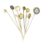 A collection of stick pins, to include some gold ones, with gemstones, two with diamond accent,