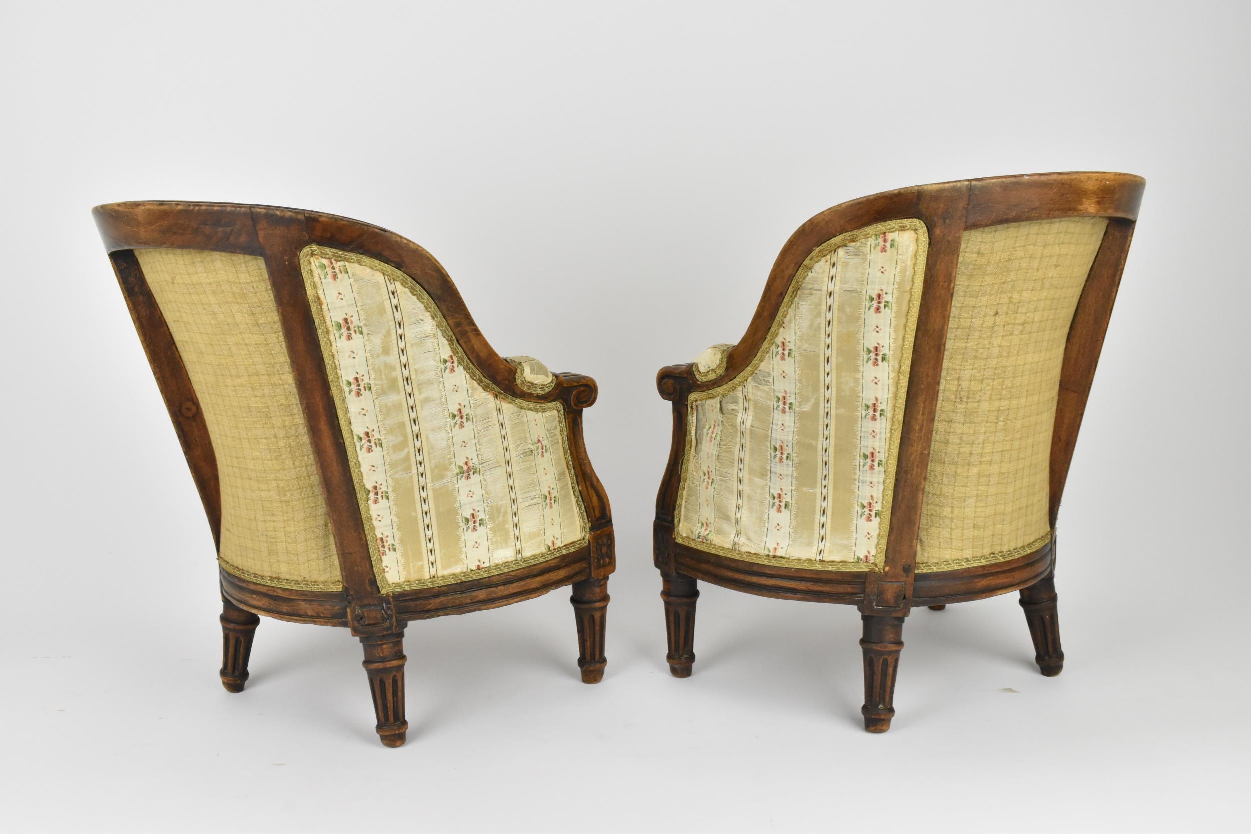 A pair of 18th century French Louis XVI bergère armchairs, circa 1780, with channelled mahogany - Image 5 of 9