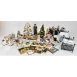 A collection of doll house Christmas themed items, together with dolls, to include a wire